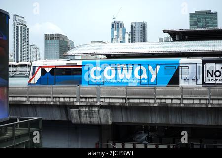 Bangkok, Thailand - 11 Feb 2022, Bangkok Mass Transit System (BTS) in close up section view is driven across the Siam Square Station from Siam Square Stock Photo