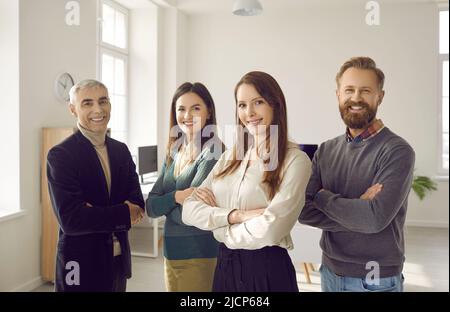 Portrait of smiling diverse businesspeople pose together Stock Photo