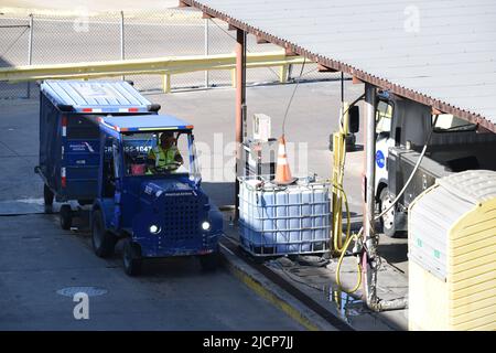 An American Airlines ramp service agent preparing to fill his tractor ...