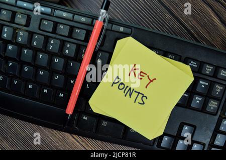 Concept of Key Points write on sticky notes isolated on Wooden Table. Stock Photo