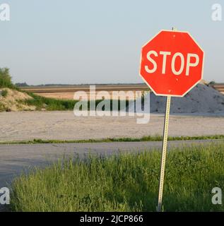 Stop sign on the right side of an image, sky in the background Stock Photo
