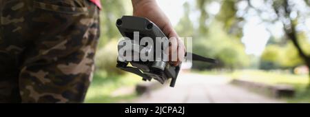 Male holding quadcopter and want to launch drone in air Stock Photo