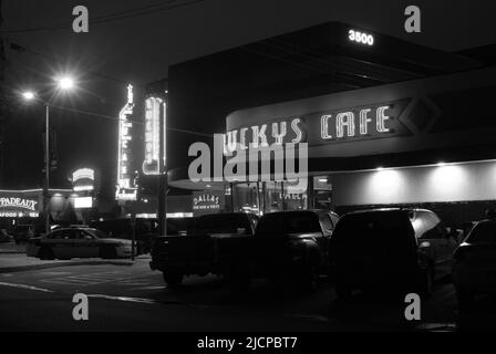 Neon signs featured on the facade of Lucky's Cafe in Dallas Texas Stock Photo