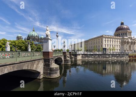 The Schloss Bridge over the Spree canal, with the Berliner Dom Cathedral on the left and the rebuilt Berlin City Palace on the right, Berlin. Stock Photo