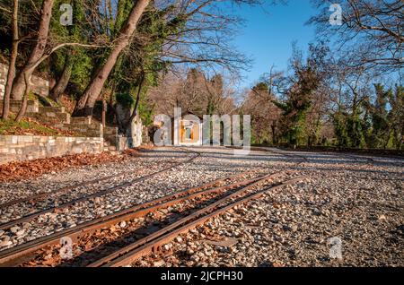 The old traditional train station located near the picturesque village named Milies. Stock Photo