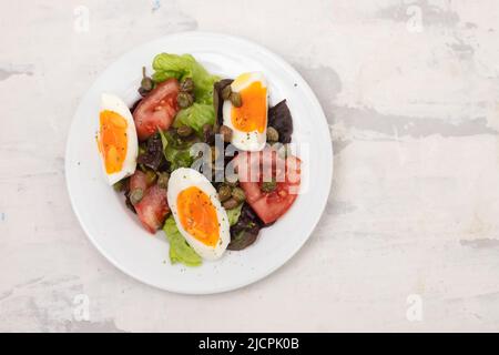 fresh vegetable salad with boiled egg on white dish Stock Photo