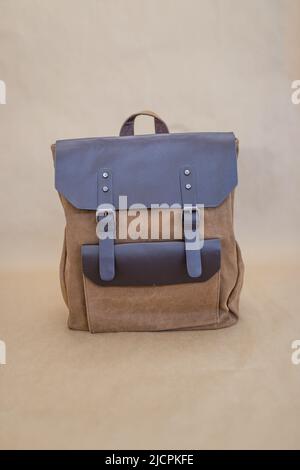 Canvas backpack isolated on beige background. Unisex bag Stock Photo