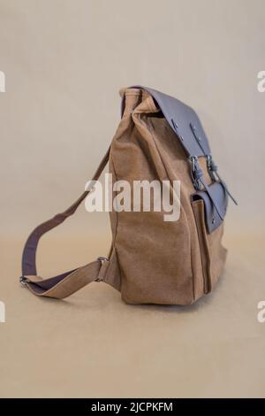 Canvas backpack isolated on beige background. Unisex bag Stock Photo