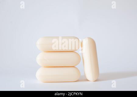 Natural soap bars with profile view isolated on white background with selective focus. Hypoallergenic for personal hygiene. Stock Photo