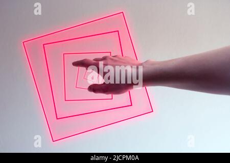 Hand entering in a neon light as a gate for metaverse Stock Photo