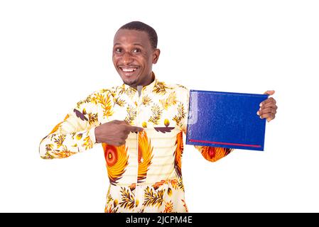 young happy businessman pointing finger at a document in his hand while smiling at the camera. Stock Photo