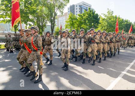 Bishkek, Kyrgyzstan - May 9, 2022: Kyrgyzstan army forces marching during a military parade on Victory Day Stock Photo