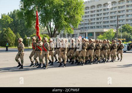 Bishkek, Kyrgyzstan - May 9, 2022: Kyrgyzstan army forces marching during a military parade on Victory Day Stock Photo