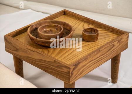 Wooden nightstand and wooden bowls isolated on white background Stock Photo