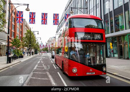 Red London Double Decker Bus, route 390 to Victoria on Oxford Street, London, England, United Kingdom on Wednesday, May 18, 2022.Photo: David Rowland Stock Photo