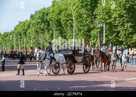 Queens Household Cavalry riding horses escorting a royal carriage along the Mall rehearsing for Trooping the Colour in London, England, United Kingdom Stock Photo