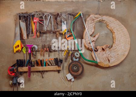 Set of tools for woodwork and sawing on shelves Stock Photo