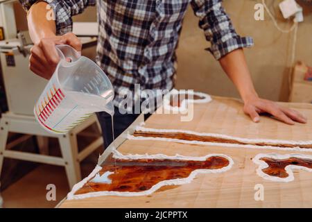 The texture of old wood with a crack and transparent epoxy resin. Beautiful  modern wooden background with resin. High quality photo Stock Photo - Alamy