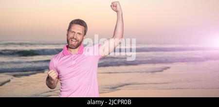 Man face portrait, banner with copy space. successful guy on sunrise beach. bearded man in shirt. celebrate success. summer vacation. Stock Photo