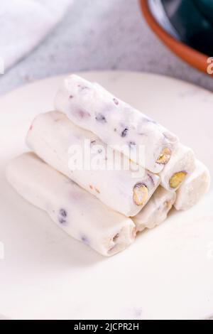 Turkish delight with pistachio milk. Turkish delight with milk flavor on a concrete floor. Traditional Turkish delicacies. close up Stock Photo