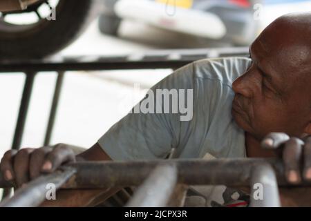 African mechanic working on a car engine. Stock Photo