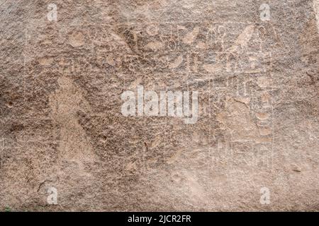 Granite boulders with pharaonic inscriptions, Aswan, Egypt Stock Photo