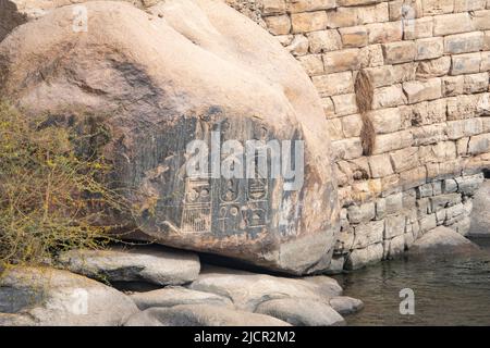 Granite boulders with pharaonic inscriptions, Aswan, Egypt Stock Photo