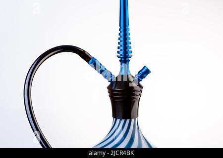 Part of a hookah isolated on a white background. Hookah with black rubber tube and white and blue flask isolated on white background. Stock Photo