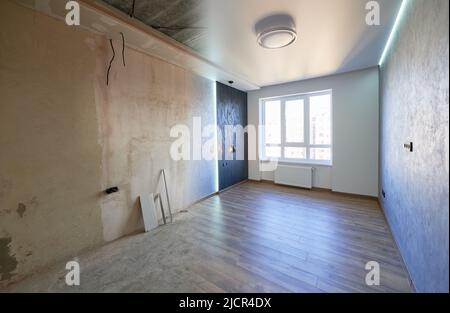 Comparison of old room and new renovated room. Photo collage of apartment before and after restoration. Concept of home renovation. Stock Photo