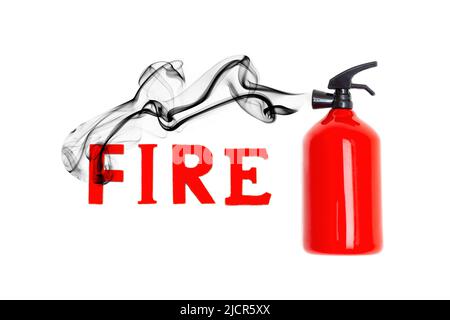 Word FIRE made from red wooden letters in black smoke coming from a toy fire extinguisher isolated on white background. Stock Photo