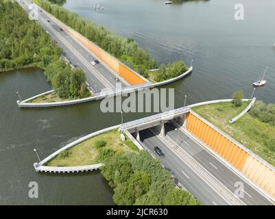 Aqueduct Veluwemeer near Harderwijk transport asphalt motorway road for traffic crossing underneath a waterway river lake infrastructure in the Stock Photo