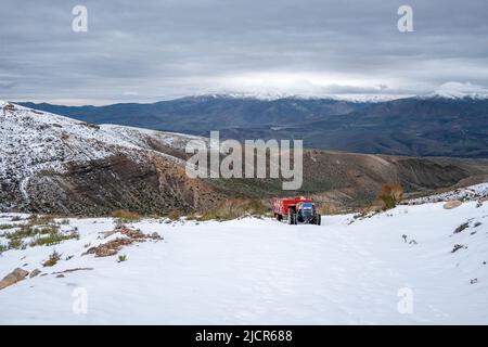 A tractor in snow covered Taurus Mountains. Niğde, Türkiye. Stock Photo