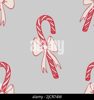 Seamless vector pattern with candy canes on grey background. Simple festive sweet wallpaper  design. Decorative Christmas fashion textile. Stock Vector