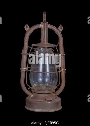 Vintage shabby and rusty kerosene lamp isolated on black Stock Photo