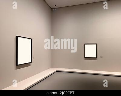 Two empty frames on the wall of a museum Stock Photo