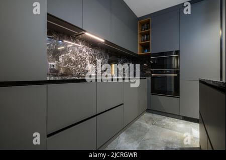 Corner view closeup to grey luxury kitchen Stock Photo