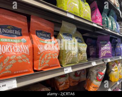 Lynnwood, WA USA - circa April 2022: Angled view of Lundberg brand rice for sale in the pantry staples aisle inside a Town and Country grocery store. Stock Photo