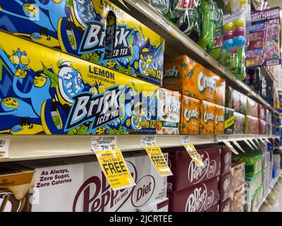 Mill Creek, WA USA - circa May 2022: Angled view of various 12 packs of beverages for sale in the soda aisle of a Safeway grocery store. Stock Photo
