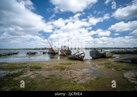 Pin Mill, England - 11 June, 2022: view of the boat graveyard at Pin Mill on the River Orwell in Suffolk at low tide Stock Photo