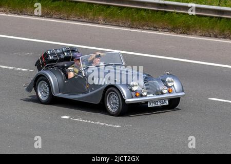 1992 90s nineties silver Morgan Plus 8, 4/4 3947cc, 4 speed automatic, 2 door convertible cabriolet ; driving on the M6 Motorway, UK Stock Photo