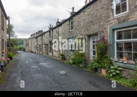 Beautiful stone cottages in the town of Langcliffe, on the edge of the Yorkshire Dales National Park, North Yorkshire, UK. Stock Photo