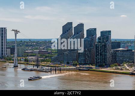 Aerial Views over the River Thames towards Greenwich Peninsular, and North Greenwich Pier and Ferry Terminal London. Stock Photo