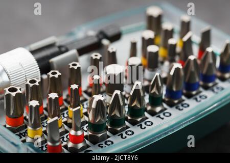 A set of metal bits for screwdrivers in a box. Hexagon head of different sizes Stock Photo