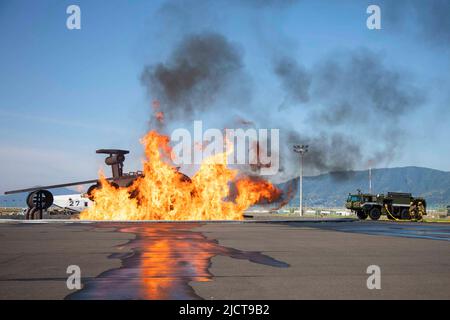 Iwakuni, Yamaguchi, Japan. 27th May, 2022. U.S. Marines with Aircraft Rescue and Firefighting of Headquarters and Headquarters Squadron conduct a live drill at Marine Corps Air Station Iwakuni, Japan, May 27, 2022. ARFF conducts monthly fire training exercises to ensure the Marines develop and maintain familiarity, confidence, and proficiency with their equipment. Credit: U.S. Marines/ZUMA Press Wire Service/ZUMAPRESS.com/Alamy Live News Stock Photo