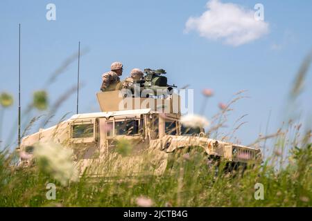 May 20, 2022 - Fort Campbell, Kentucky, USA - U.S. Reserve Marines assigned to the Combined Anti-Armor Team, Weapons Company, 3rd Battalion, 23rd Marine Regiment, 4th Marine Division, fire an Humvee-mounted M240B machine gun during a mission rehearsal exercise at Fort Campbell, Kentucky, May 19, 2022. Weapons Company convened with other units from 3/23 at Fort Campbell for a mission rehearsal exercise to prepare for the upcoming Integrated Training Exercise 4-22 in the summer of 2022. The Combined Anti-Armor Team Marines conducted machine gun ranges and convoy operations with quick reaction dr Stock Photo