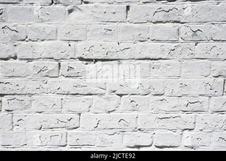 Grunge white brick wall background with aging texture closeup Stock Photo