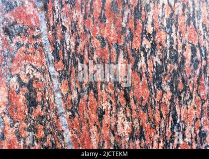 Red granite texture. Natural red granite stone. Stock Photo