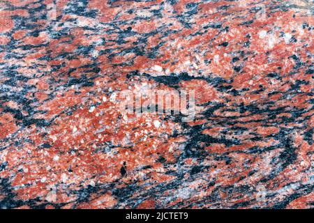 Red granite texture. Natural red granite stone. Stock Photo