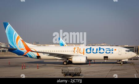 Dubai, UAE, 05.11.21. Flydubai low-cost airline Boeing 737-800 NG parked on apron at Dubai International Airport DXB before departure. Stock Photo