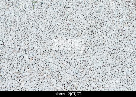 Natural white granite rubble, chippings or crushed stones background top view Stock Photo